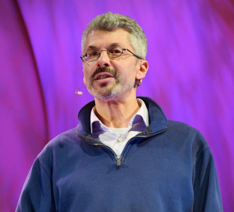 Photo of Faculty Jonathan Marks speaking on a stage.